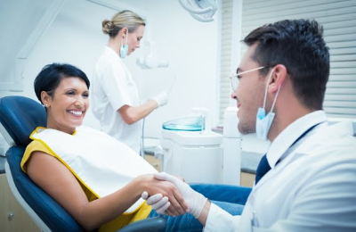 lady smiling at the dentist's office